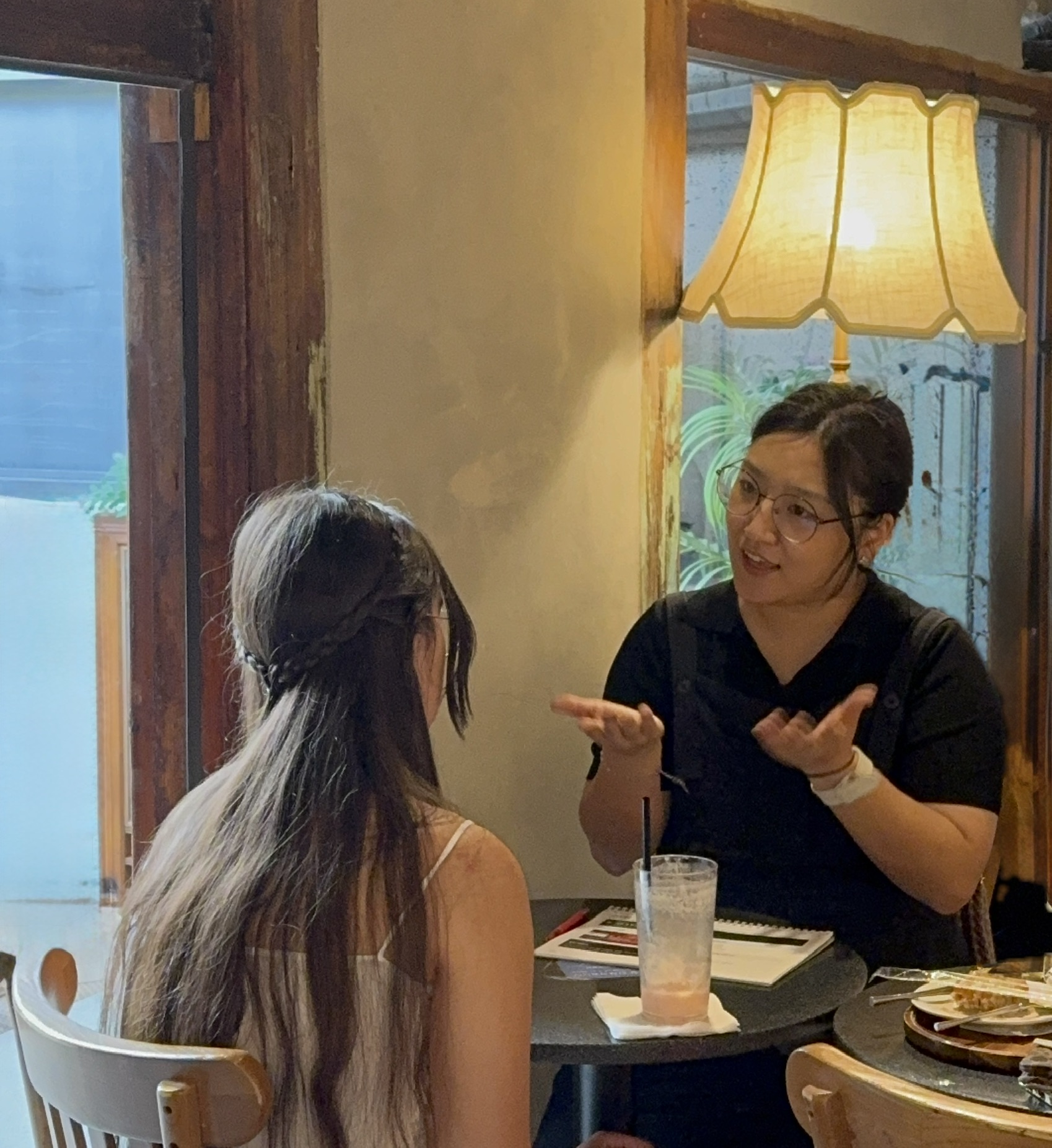 A student smiling during a one-on-one Korean lesson
